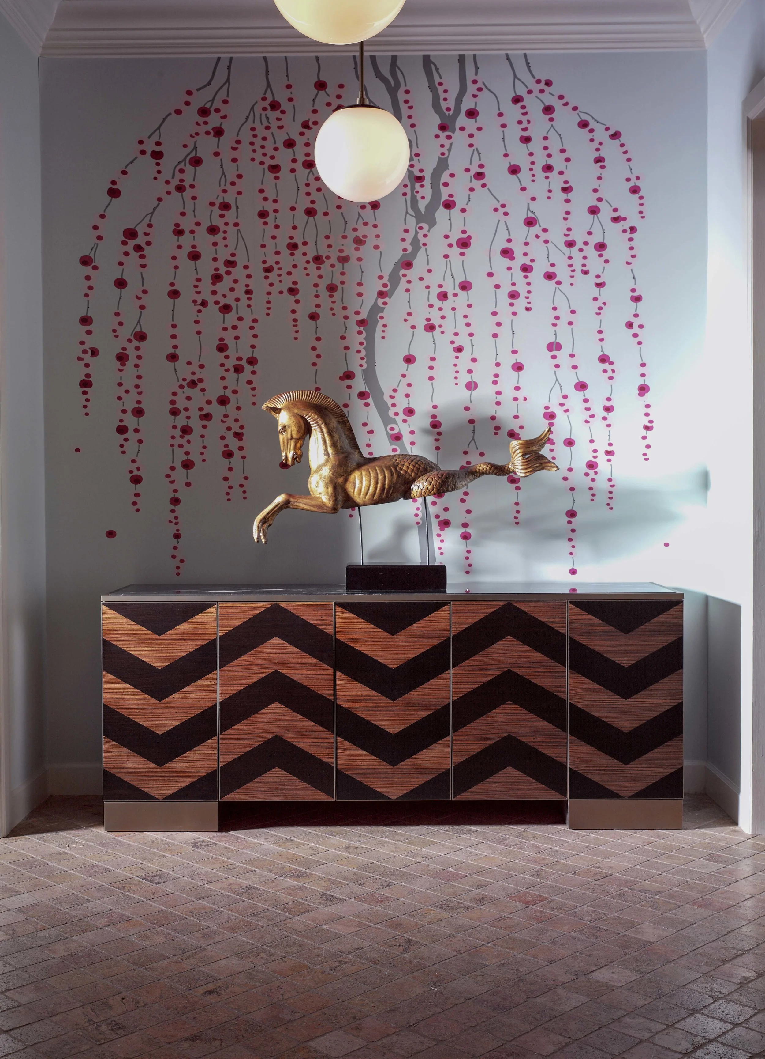 Entryway illustration with chevron-patterned credenso, whimsical dot mural on the wall, sketched in soft charcoal and olive ink